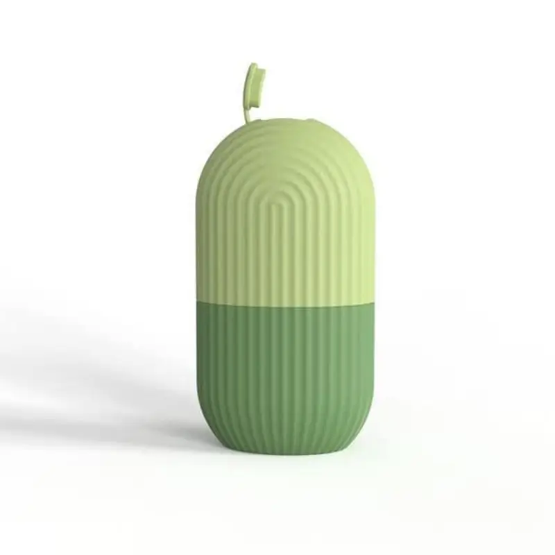 Ice roller shown with a cucumber-and-water filled head next to the closed roller