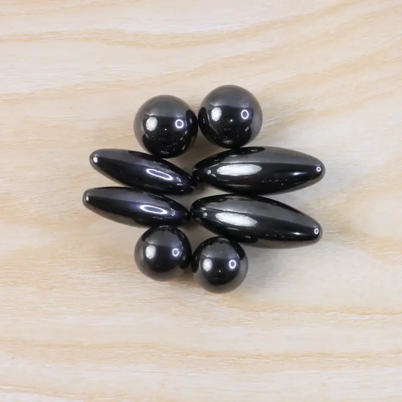 Magnetic spheres and oval pieces arranged in a flower pattern, attracted together